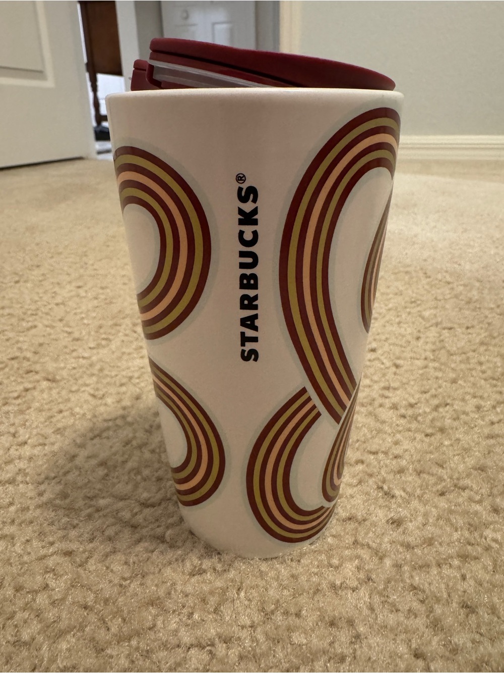 Starbucks White Ceramic Tumbler with Red and Gold Curved Stripe Pattern -12 oz
